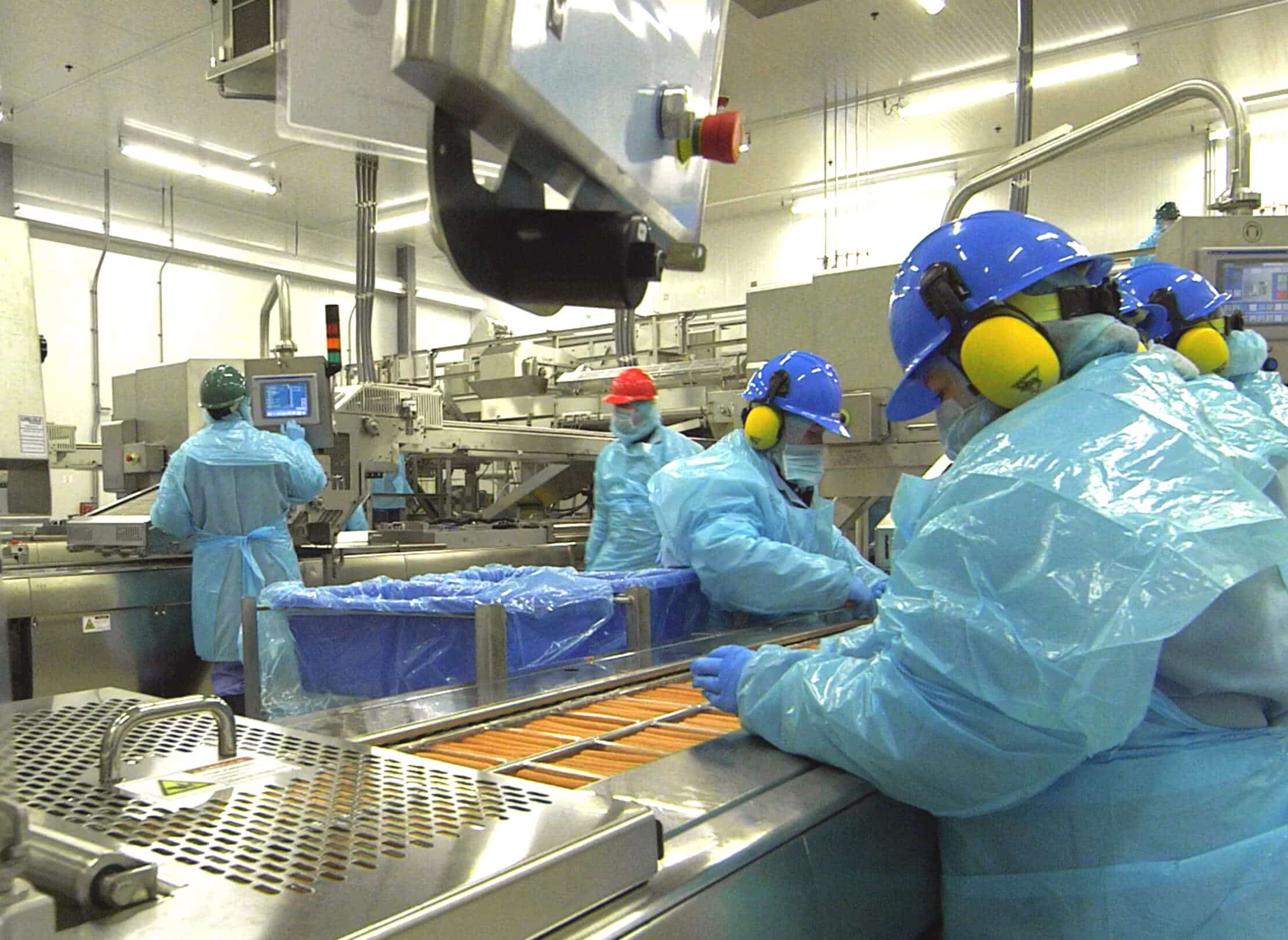 Plant employees working on production line.