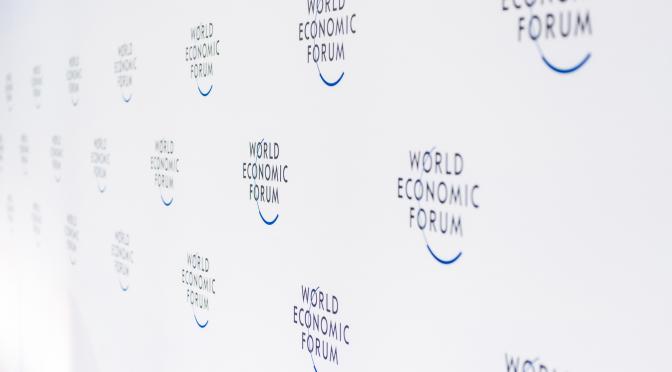 White wall with World Economic Forum logos