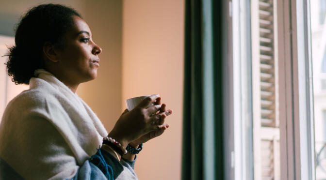 Woman looking out of a window