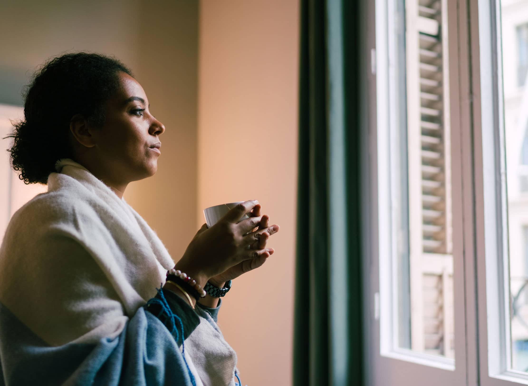 Woman looking out of a window