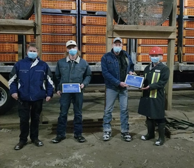 employee receiving animal care monthly caring hands award