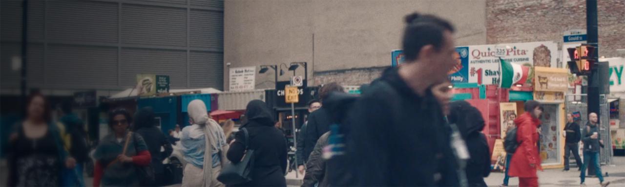 Blurred image of people walking on a street