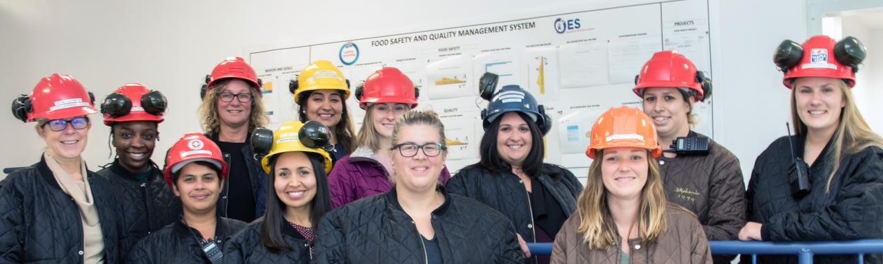 Women standing in front of food safety whiteboard