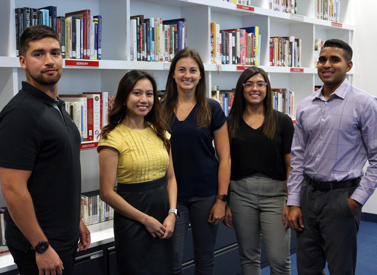 Maple Leaf Foods Leadership Track Graduate Program participants in library.