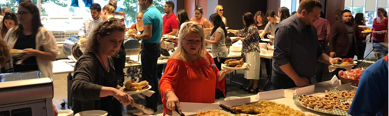 Employees at buffet celebrating cultural diversity.
