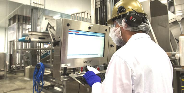 Team member reading a computer screen