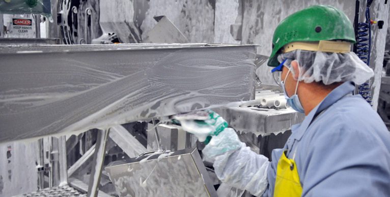 Sanitizing and deep cleaning of production line machines at a Maple Leaf Foods plant.