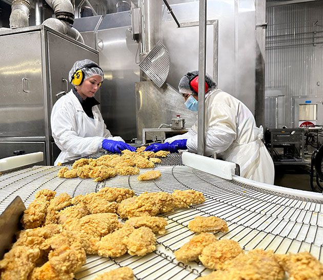 employees packaging chicken at Courtneypark plant