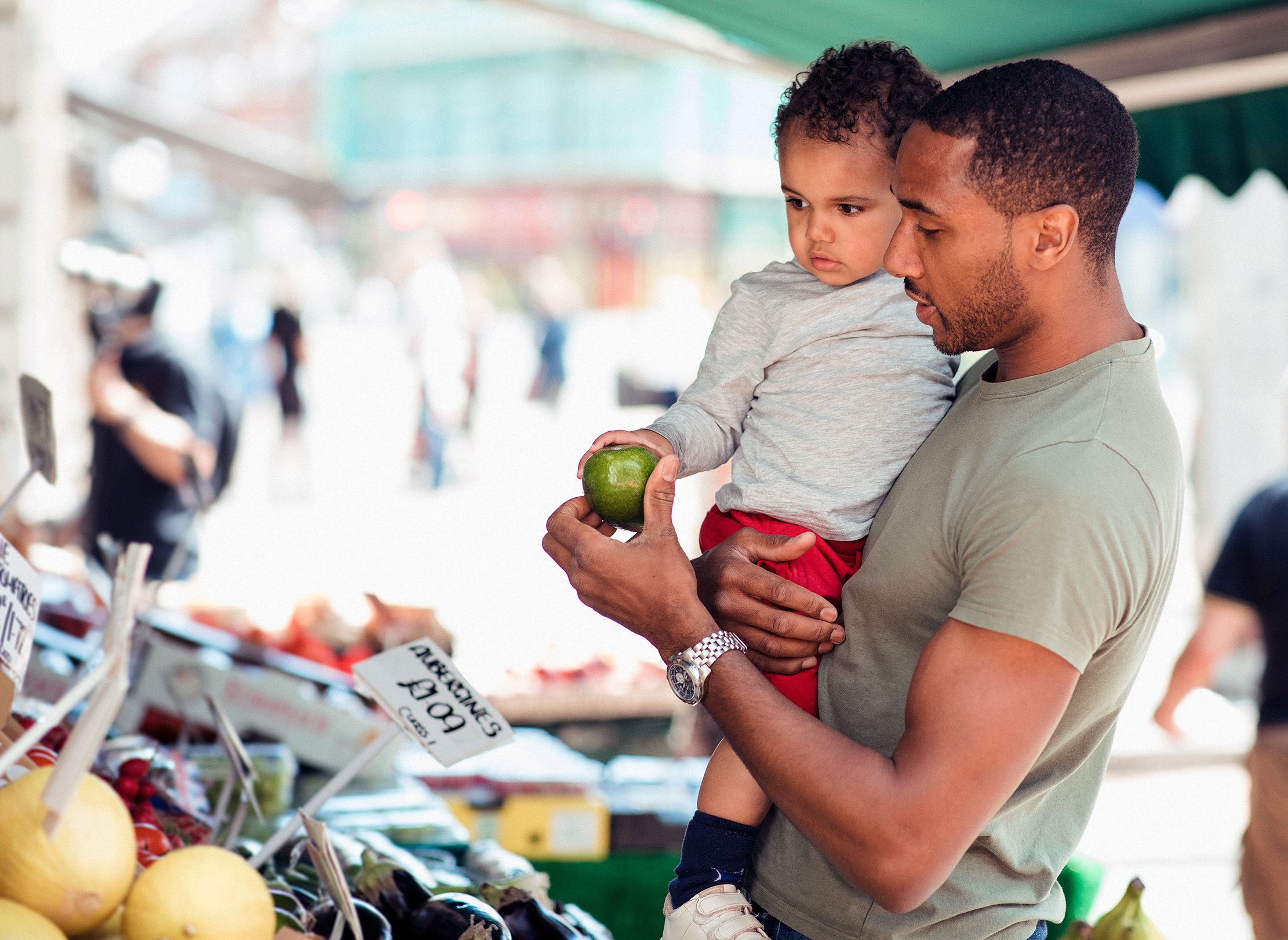 Father and son at a market