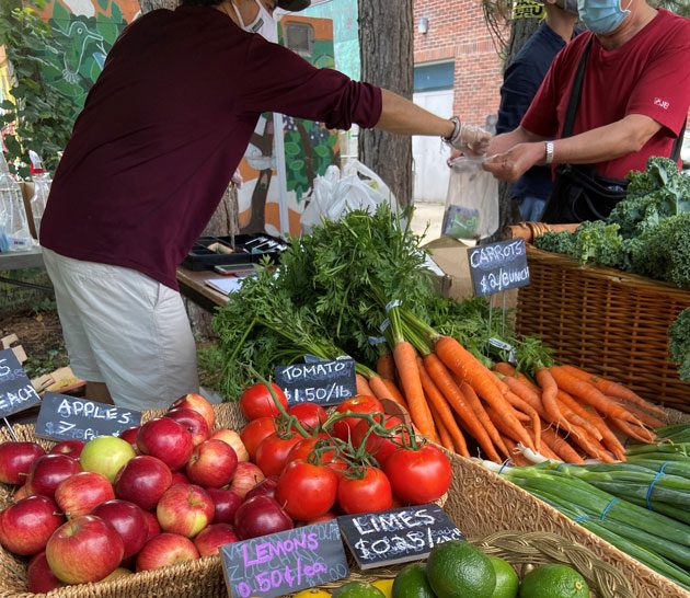 Selling fruit and vegetables at a FoodShare Good Food Market in Toronto.