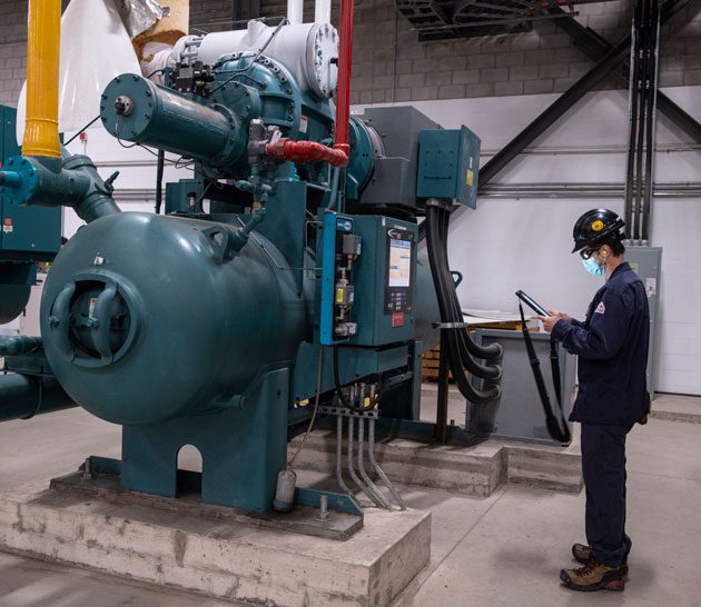 Examining machine at Hamilton manufacturing plant