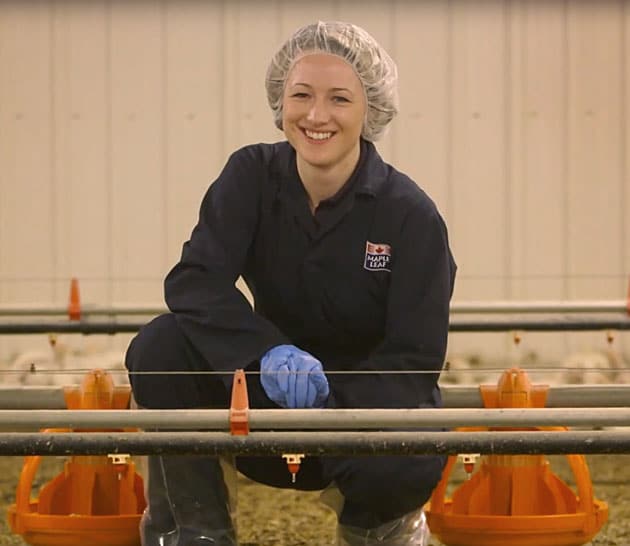 Kathleen Long, inside a poultry barn