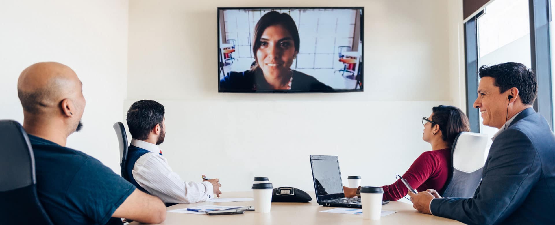 team members having meeting with virtual guest