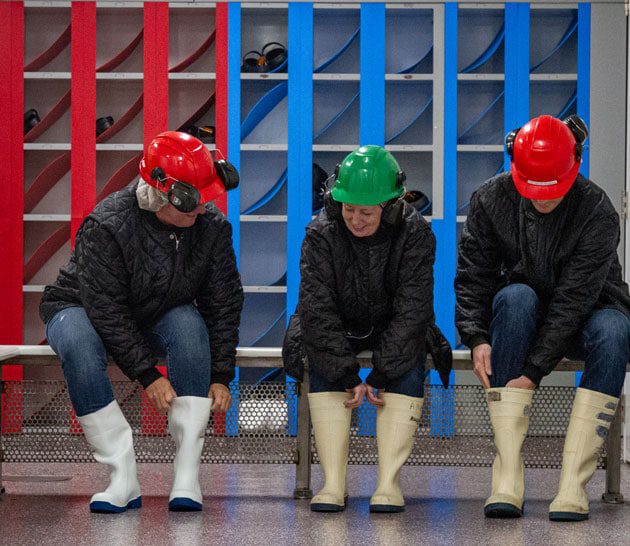 Putting on boots before entering production floor in Hamilton plant