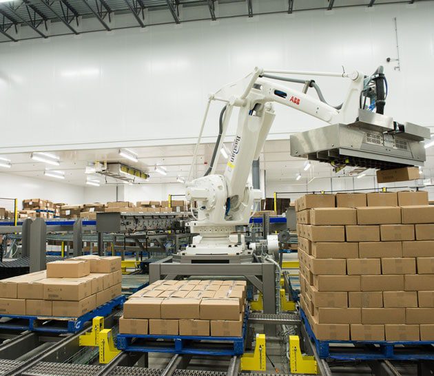 Stacking product boxes at Hamilton manufacturing plant