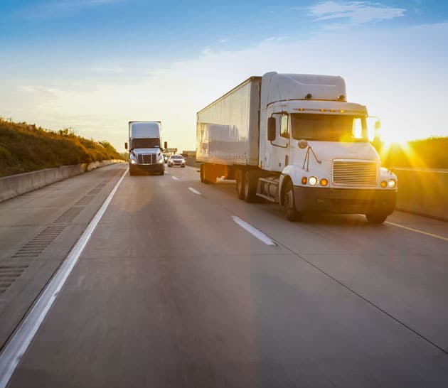 Two trucks on a highway