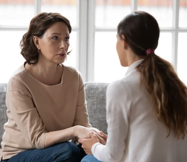 Two women supporting each other