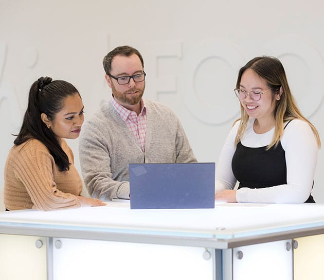 Team members going over a presentation