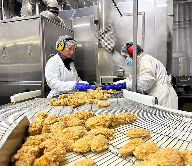 QA Team in Brampton, inspecting chicken nuggets