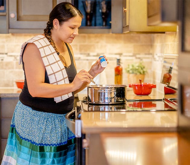 woman cooking in kitchen