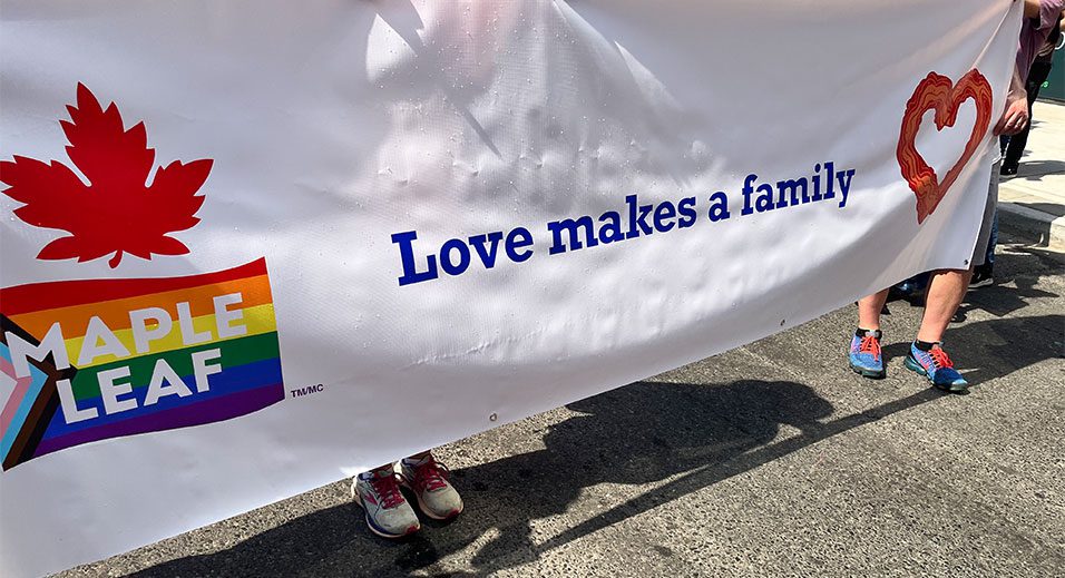 Maple Leaf Foods' "Love makes a family" banner at Pride Parade