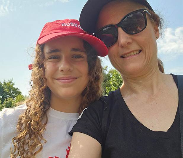 Kristie with her daughter Karolyn at McQuesten Urban Farm as part of Maple Leaf Foods’ Raise the Good in the Neighborhood volunteer program in the summer of 2025.
